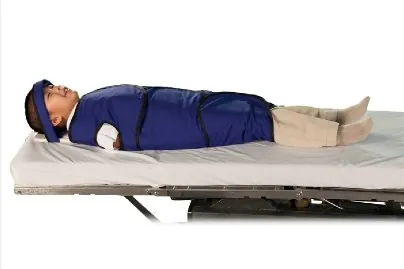 I child in a dental papoose